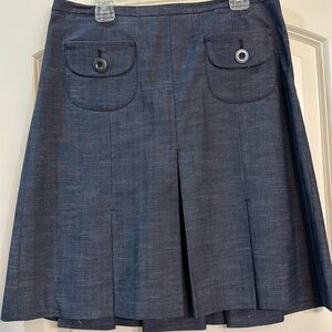 Pleated skirt with adorable front pockets.